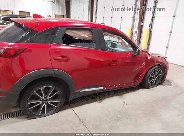 JM1DKFD77H0158031 2017 MAZDA CX-3 Red Widok wnętrza z tyłu