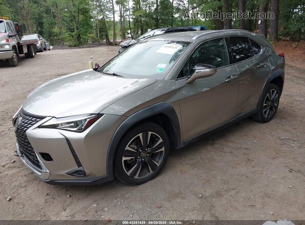 JTHX3JBH8M2036171 2021 LEXUS UX 200 Champagne Vista tres cuartos delantera izquierda