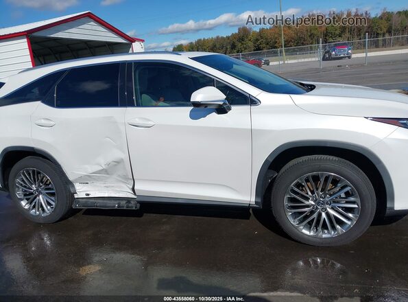 JTJJGKFA4M2016799 2021 LEXUS RX 450HL White Vista interior trasera
