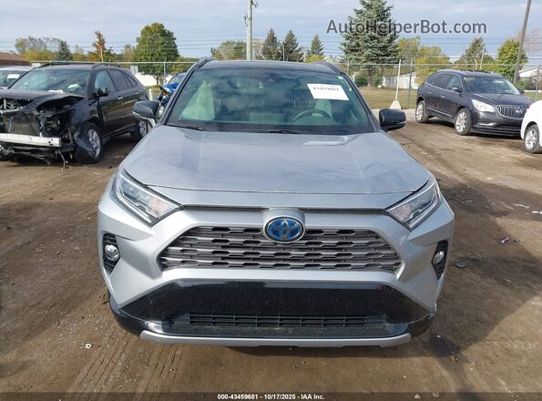 JTMEWRFV2KJ024423 2019 TOYOTA RAV4 HYBRID Silver Rear interior view