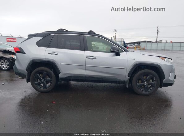 JTMEWRFV9KD512069 2019 TOYOTA RAV4 HYBRID Gray Vista interior trasera