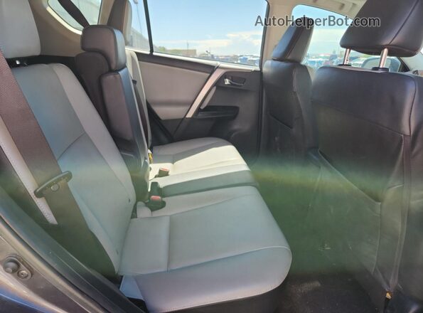 JTMYFREV9JJ201322 2018 TOYOTA LIMITED Gray Vista de los asientos traseros