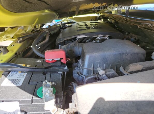 JTNKARJE2GJ511049 2016 TOYOTA SCION Yellow Вид задньої частини салону