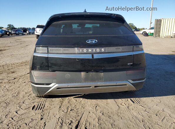 KM8KNDAF0NU109302 2022 HYUNDAI IONIQ Black Հետևի տեսք