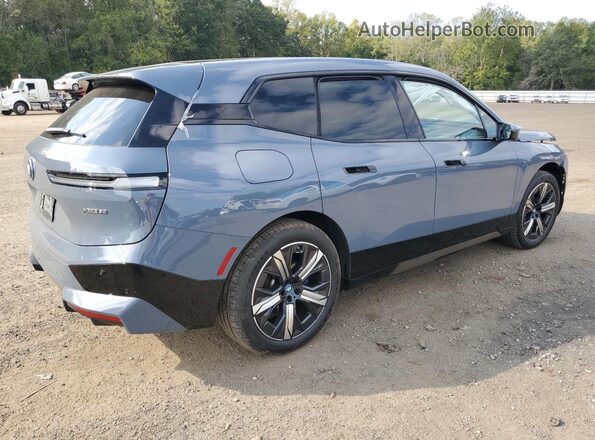 WB523CF05RCP41602 2024 BMW IX Blue Trasero derecho
