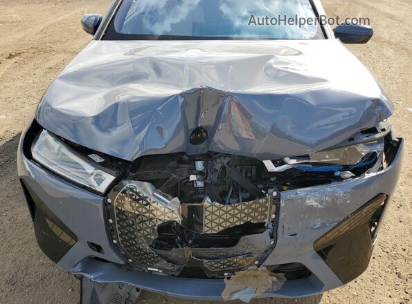 WB523CF05RCP41602 2024 BMW IX Blue Vista del compartimento del motor