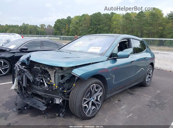 WB523CF06PCM07589 2023 BMW IX Turquoise Vista tres cuartos delantera izquierda