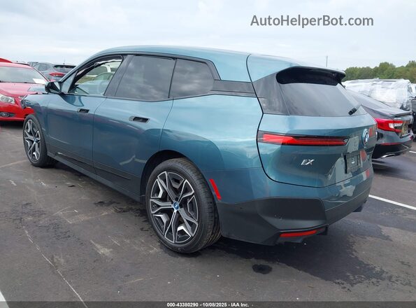 WB523CF06PCM07589 2023 BMW IX Turquoise Trasero izquierdo