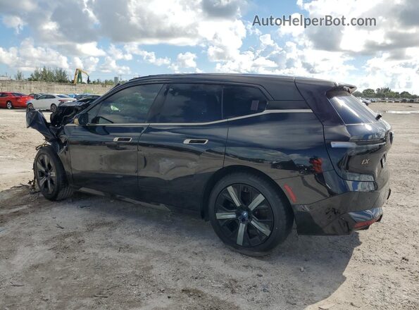WB523CF06PCM84978 2023 BMW IX Black Trasero izquierdo