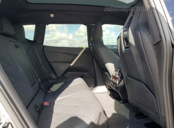 WB523CF06PCM84978 2023 BMW IX Black Vista interior trasera