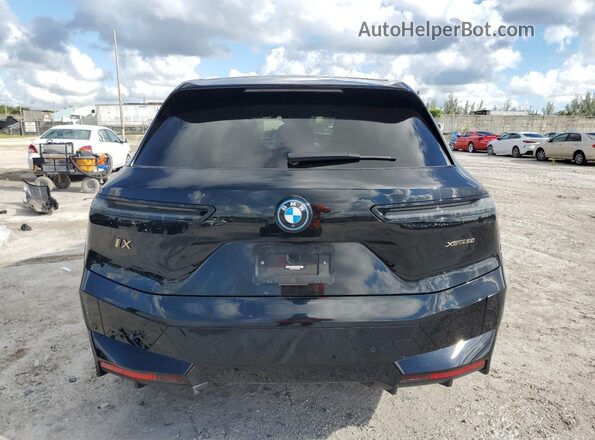 WB523CF06PCM84978 2023 BMW IX Black Vista trasera