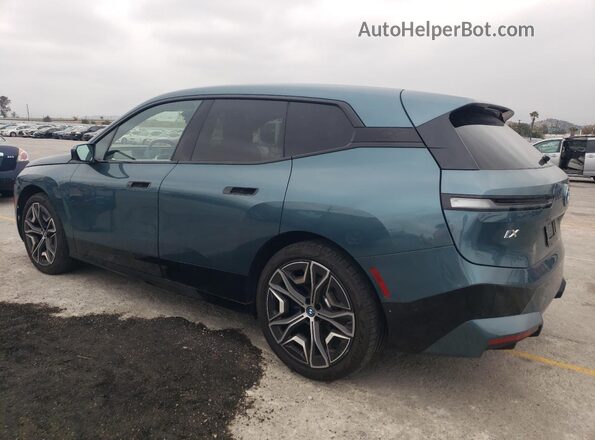 WB523CF07RCR72663 2024 BMW IX Бирюзовый Задняя левая четверть