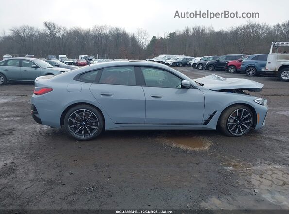 WBA63AV0XNFM77360 2022 BMW 4 SERIES Light Blue Սալոնի հետևի տեսք