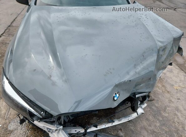 WBAGV8C06NCH21679 2022 BMW M8 Gray Vista interior trasera