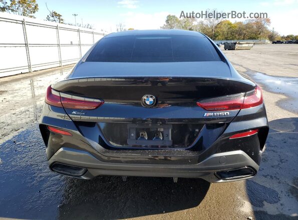 WBAGV8C09NCH96974 2022 BMW M8 Black Rear view