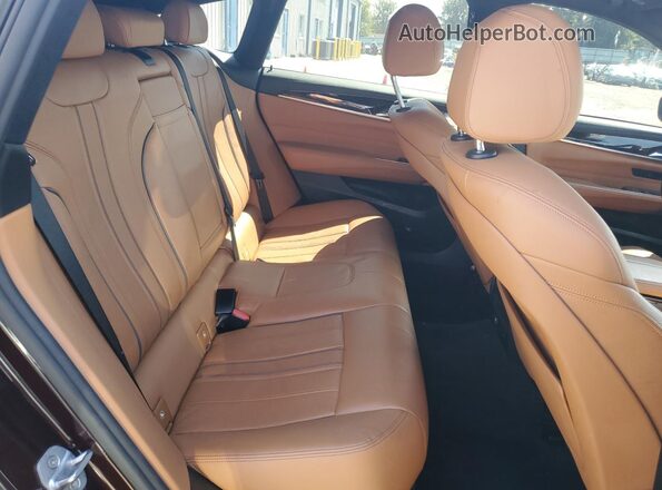 WBAJV6C54JBJ99802 2018 BMW 6 SERIES Burgundy Rear interior view