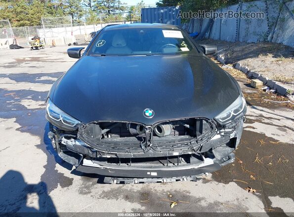 WBSAE0C0XLCD94929 2020 BMW M8 Gray Widok wnętrza z tyłu