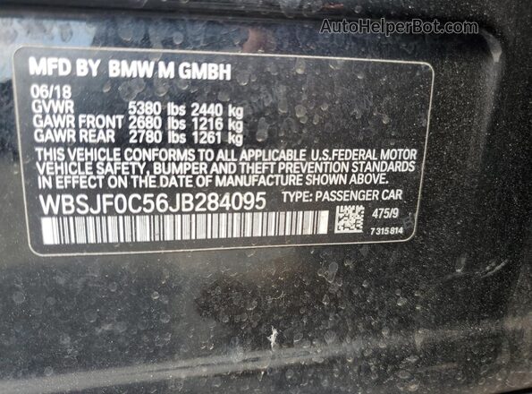 WBSJF0C56JB284095 2018 BMW M5 Black Vista del compartimento del motor