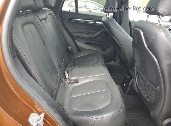 WBXHT3C33GP885221 2016 BMW X1 Brown Vista interior trasera