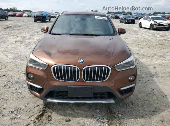 WBXHT3C33GP885221 2016 BMW X1 Brown Vista frontal