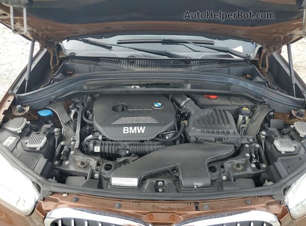 WBXHT3C33GP885221 2016 BMW X1 Brown Vista del compartimento del motor
