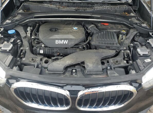 WBXHT3C57K5N57743 2019 BMW X1 Black Engine compartment view