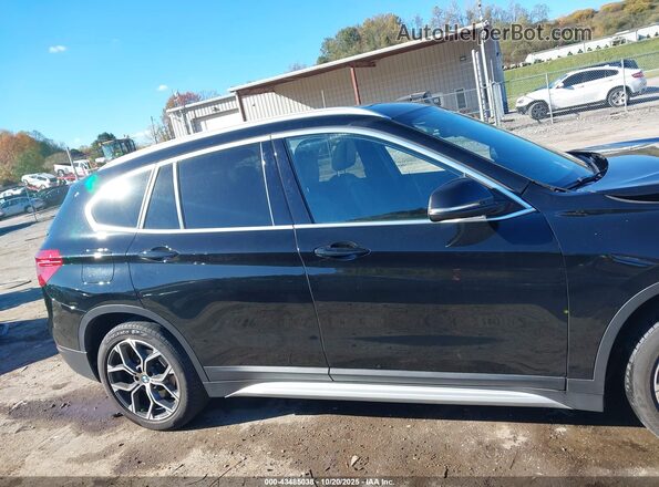 WBXJG9C01L5R31648 2020 BMW X1 Black Սալոնի հետևի տեսք