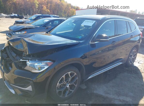 WBXJG9C01L5R31648 2020 BMW X1 Black Առջևի ձախ երեք քառորդ տեսարան