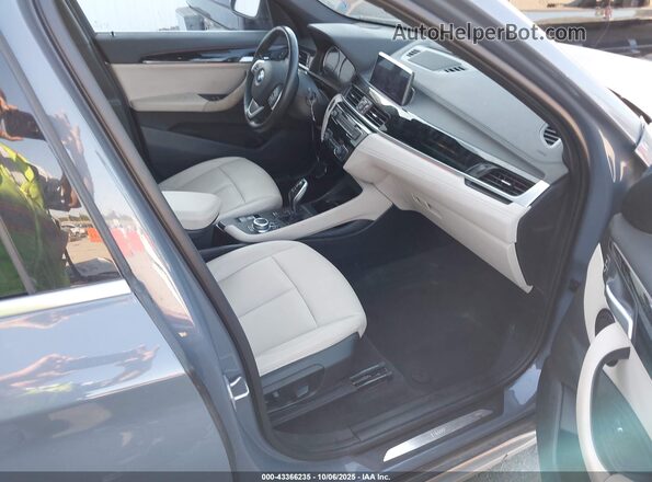 WBXJG9C04M3M68370 2021 BMW X1 Light Blue Front interior view