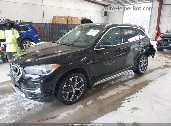WBXJG9C09L3L83796 2020 BMW X1 Black Առջևի ձախ երեք քառորդ տեսարան