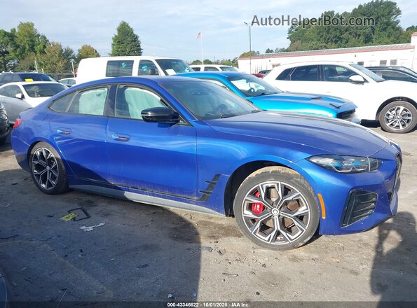 WBY73AW04PFN50536 2023 BMW I4 Blue Vista interior trasera