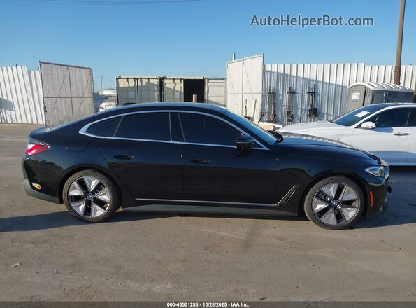 WBY73AW09PFR30259 2023 BMW I4 Black Սալոնի հետևի տեսք