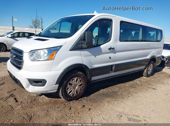 1FBAX2Y82LKA60686 2020 FORD PASSENGER White Front left