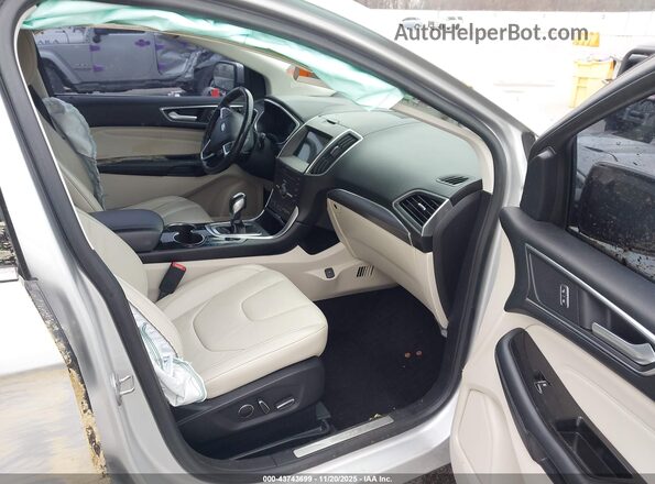 2FMPK4K91GBB23712 2016 FORD EDGE Серебряный Вид салона спереди