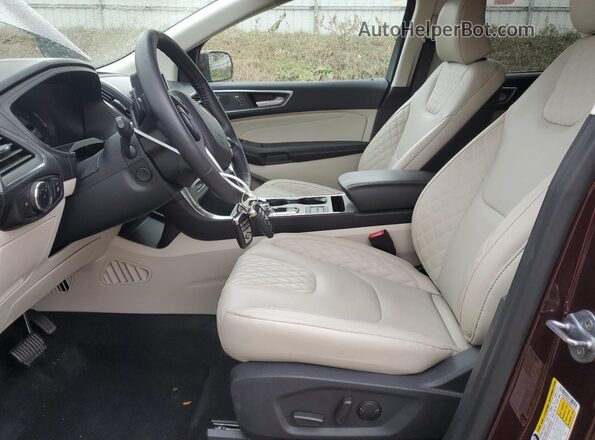 2FMPK4K92RBA73132 2024 FORD EDGE Burgundy Vista interior delantera