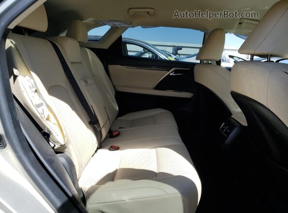 2T2AZMAA4MC216613 2021 LEXUS RX Tan Vista interior trasera