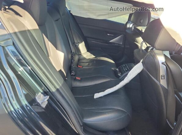 WBS6E9C5XGG437103 2016 BMW M6 Black Вид задньої частини салону
