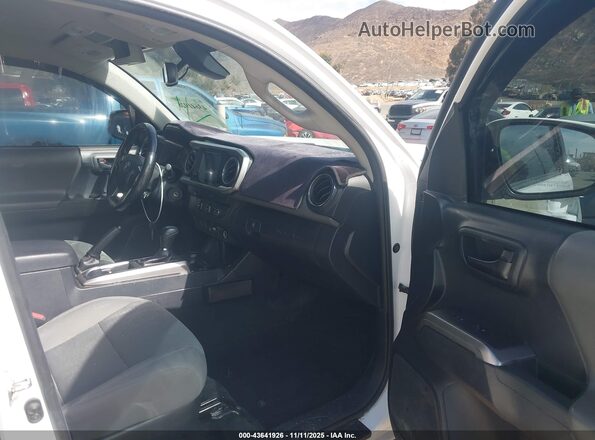 3TMBZ5DN3KM020115 2019 TOYOTA TACOMA Белый Вид салона спереди