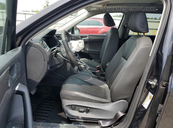 3VVNB7AX0RM077211 2024 VOLKSWAGEN TIGUAN Black Front interior view