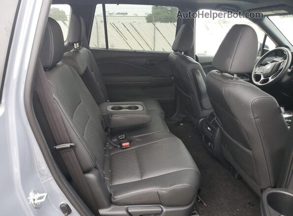 5FNYF8H04PB003015 2023 HONDA PASSPORT Blue Սալոնի հետևի տեսք