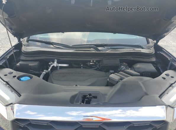 5FNYF8H55PB041767 2023 HONDA PASSPORT Blue Vista del compartimento del motor