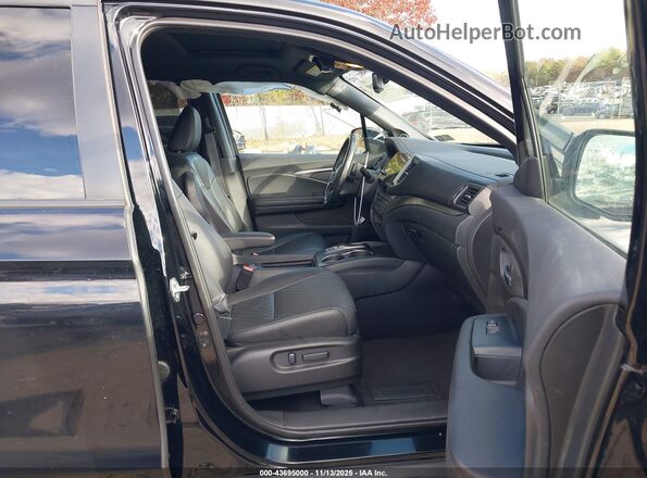 5FNYF8H57MB004862 2021 HONDA PASSPORT Black Front interior view