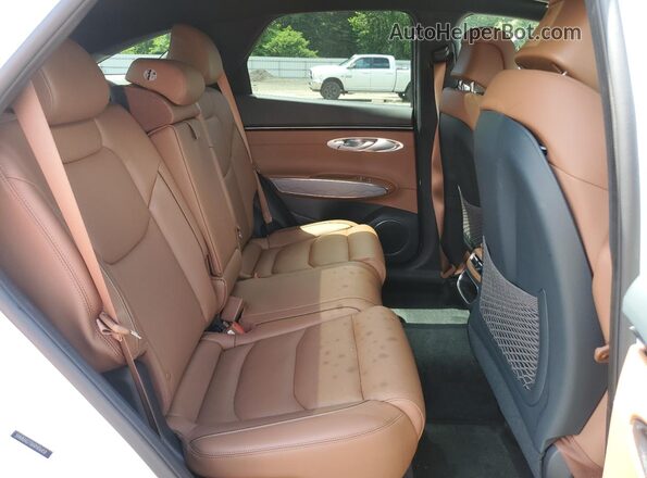 5NMMADTB4RH016458 2024 GENESIS GV70 White Rear interior view