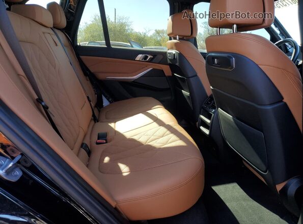 5UX23EU07R9S36319 2024 BMW X5 Blue Widok wnętrza z tyłu