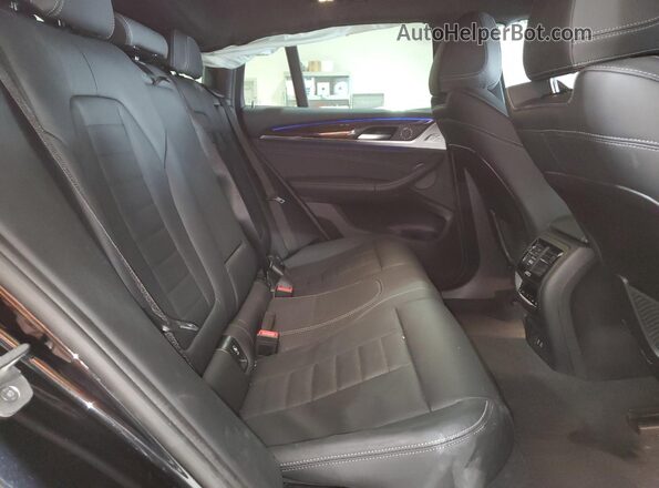 5UX2V1C02M9F43235 2021 BMW X4 Black Vista interior trasera