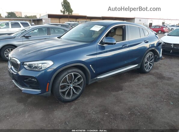 5UX2V1C07L9B50328 2020 BMW X4 Blue Առջևի ձախ երեք քառորդ տեսարան