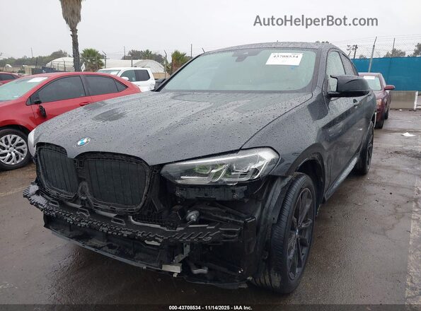 5UX33DT09N9J09596 2022 BMW X4 Black Vista tres cuartos delantera izquierda