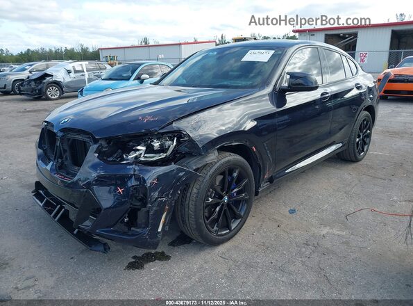 5UX43DT05N9L84015 2022 BMW X4 Dark Blue Առջևի ձախ երեք քառորդ տեսարան