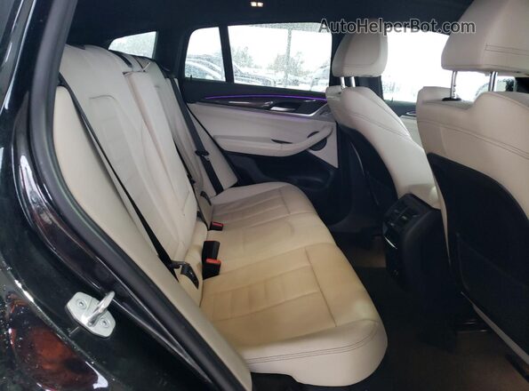 5UX43DT09P9P93153 2023 BMW X4 Black Vista interior trasera
