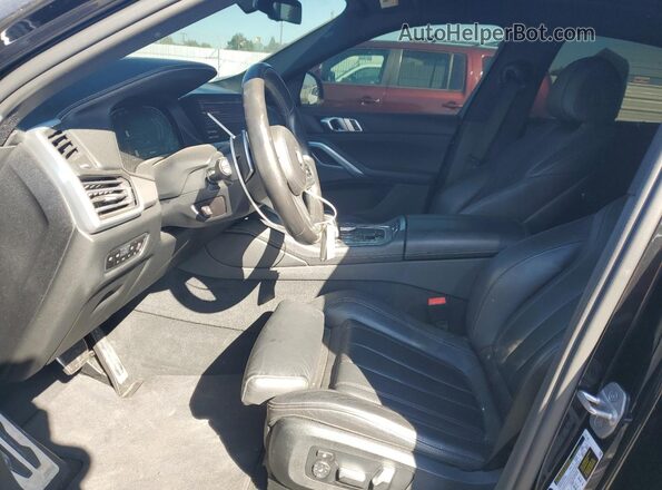 5UXCY6C00L9D11899 2020 BMW X6 Black Widok wnętrza z przodu